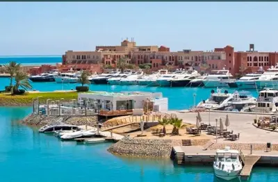 a marina with boats in the water and a city at El Gouna in Hurghada