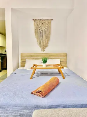 a bedroom with a bed with a table on it at El Gouna in Hurghada