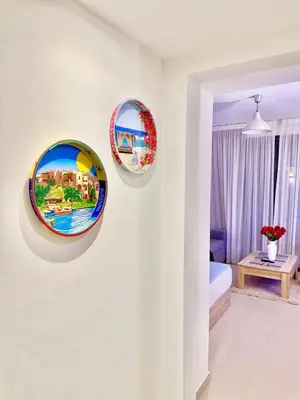 three plates hanging on a wall in a room at El Gouna in Hurghada