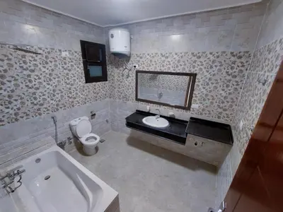 a bathroom with a sink and a toilet and a tub at الاقصر in Luxor