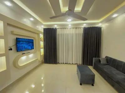 a living room with a couch and a tv at الاقصر in Luxor
