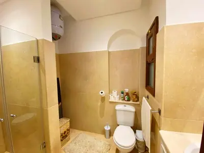 a bathroom with a toilet and a shower at El Gouna - Sabina - Lagoon Chalet - 2 bedrooms - Ground Floor in El Gouna