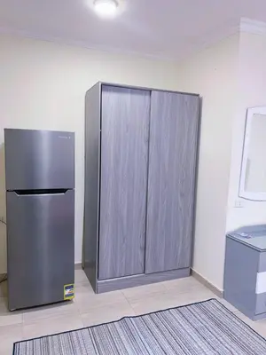 a stainless steel refrigerator in a room at Princess Resort Hurghada in Hurghada