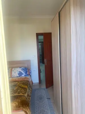 a bedroom with a bed and a closet at Princess Resort Hurghada in Hurghada