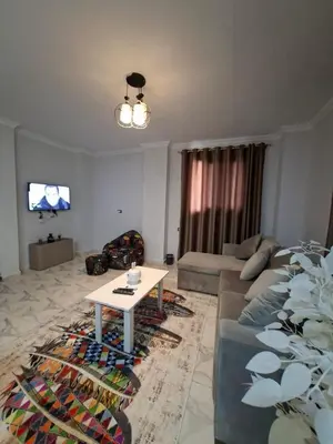 a living room with a couch and a table at Apartment for Rent Hurghada, Oasis Marina Resort in Hurghada