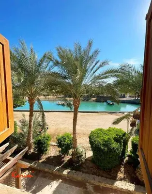a view of a resort with palm trees and a pool at Studio For Rent in El Gouna Kafr in Hurghada