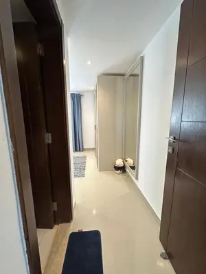 a room with a hallway with a blue rug at Refined Two-Bedroom with Pool View Gcribs ElGouna in El Gouna