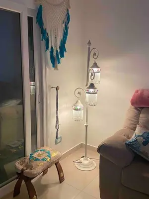 a living room with a couch and some lights on the wall at One bedroom apartment with stunning sea view in Hurghada