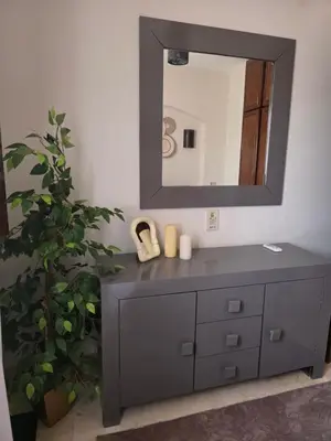 a bathroom with a vanity with a mirror and a plant at Westgolf Y62 in Hurghada