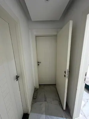 an empty room with a door and a tile floor at Elegant 3BR Luxury Suite - Fanadir Bay in Hurghada