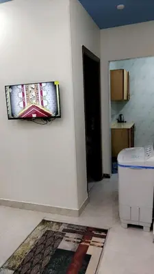 a room with a wall with a picture on the wall at Apartment in sherry street near sheraton in Hurghada