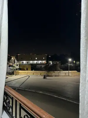 a view of an empty street at night at Dahabiya Apartment in Luxor