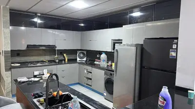 a kitchen with a stove and a refrigerator at Magwish in Hurghada