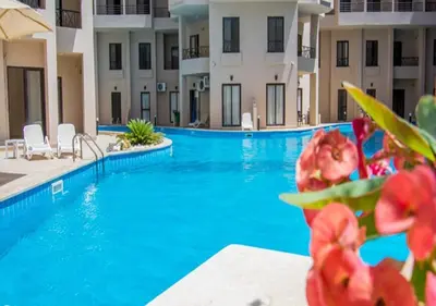 a view of a swimming pool at a hotel at Luxury One-Bedroom Apartment Near El Gouna in Hurghada