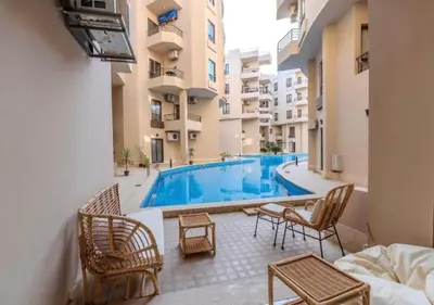 a swimming pool in the middle of a building at Luxury One-Bedroom Apartment Near El Gouna in Hurghada