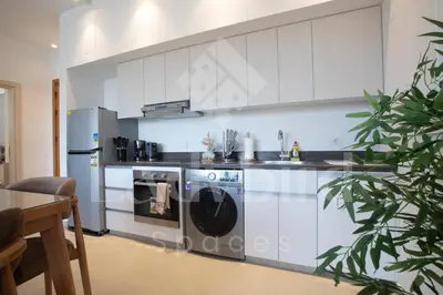 a kitchen with a refrigerator and a washer and dryer at Ladybird - Kamaran Pearl in Hurghada