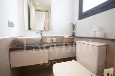 a bathroom with a white toilet and a sink at Ladybird - Kamaran Pearl in Hurghada