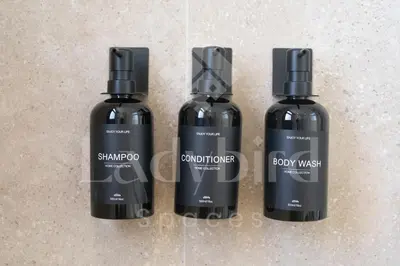 three bottles of shampoo and conditioner on a counter at Ladybird - Kamaran Pearl in Hurghada