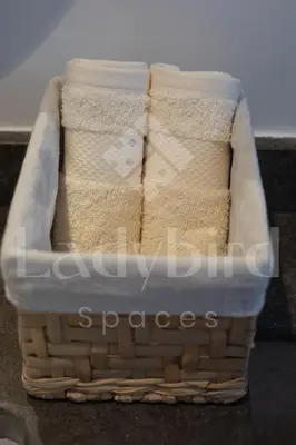 a basket full of towels sitting on a counter at Ladybird - Kamaran Pearl in Hurghada