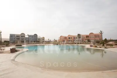 a swimming pool in the middle of a resort at Ladybird - Kamaran Pearl in Hurghada