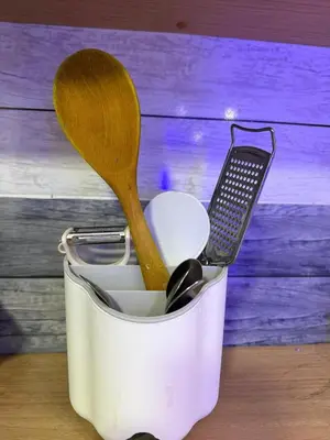 a container with a spatula and a spoon in it at Hub Hurghada Two Bedroom Luxury Apartment in Hurghada