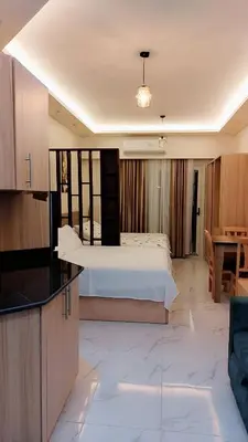a large room with a bed and a kitchen at فندق جوليانا بيتش in Hurghada