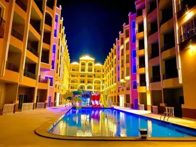 a large swimming pool in the middle of a building at Juliana Beach Resort, Hurghada in Hurghada