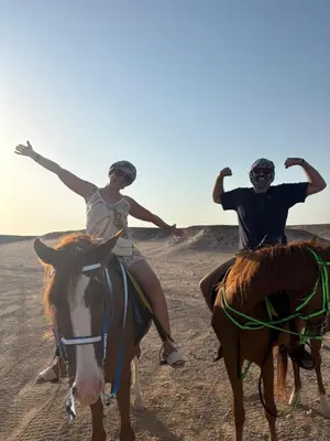 two people riding on horses in the desert at Horse Riding Tour in Hurghada