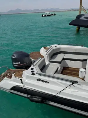 a white boat sitting on top of the water at Speed Boat Tour Hurghada 4 Hours in Hurghada