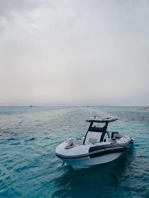 a white boat in the middle of the water at Speed Boat Tour Hurghada 4 Hours in Hurghada