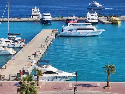a group of boats docked in a harbor at عماره المهندس in Hurghada