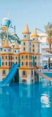 a castle in the middle of a swimming pool at Apartment for daily rent free beach access in Hurghada
