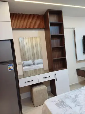 a bedroom with a mirror and a bed at Tiba Golden Resort Hurghada in Hurghada