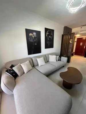 a living room with a couch and a table at Benashti Hurghada apartment in Hurghada
