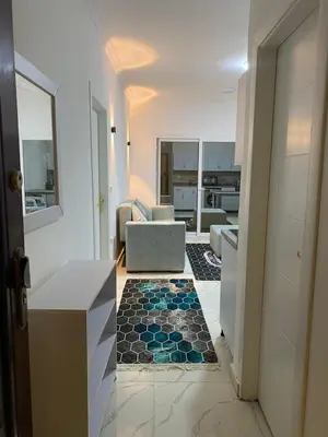 a living room with a couch and a floor at الكوثر in Hurghada