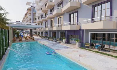 an image of a swimming pool in front of a building at فلورينزا in Hurghada