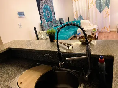 a kitchen sink with a faucet and a sink at Bright 2BR & Office, Remote Work Ready & Long Stays in Hurghada