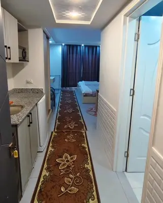 a hallway with a carpet in the middle of a room at Scandic Resort in Hurghada