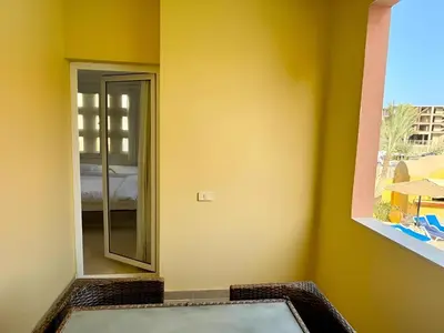 a bathroom with a mirror and a bath tub at Stunning Pool and Sea View Villa, Al Dora Resort, Hurghada in Hurghada