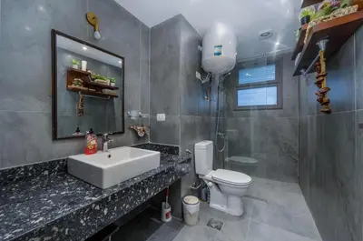 a bathroom with a sink and a toilet and a mirror at Exclusive Heated Pool Chalet for a Luxury in Hurghada