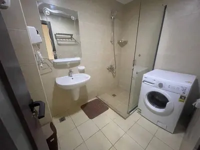 a bathroom with a washing machine and a sink at Mark one bedroom sea view in Hurghada