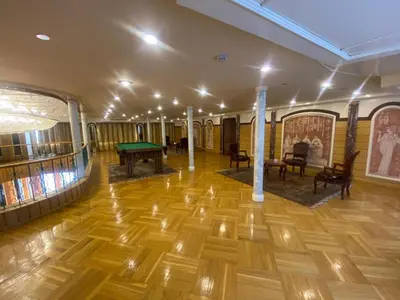 a room with a ping pong table and chairs at tarot and tamr and sun rise nile cruises in Luxor