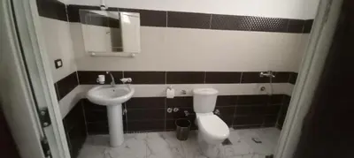 a bathroom with a toilet and a sink at Apartment with Balcony in Luxor