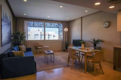 a living room with a couch and a table at Mangroovy Beach Front - 1 BR - Free Beach & Pool access in Hurghada