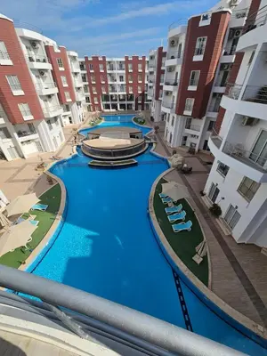 arial view of a swimming pool in a apartment complex at Aqua palms resort 2 bed flat C409 in Hurghada