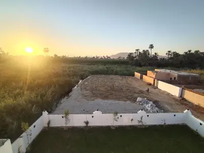 a view of the sunset from the roof of a house at Luxor heaven apartment in Luxor