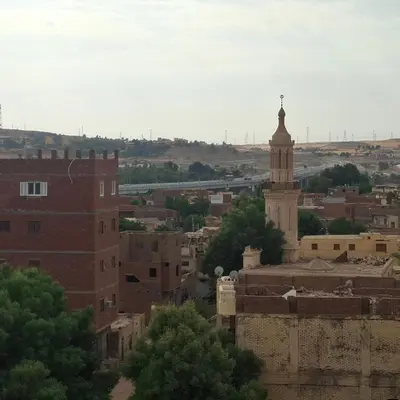 a view of a city with a clock tower at Julia's Guest House in Shellal