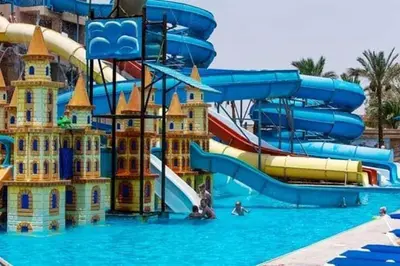 a water park with a water slide and slides at Mirage Bay Resort Hurghada B-794 in Hurghada