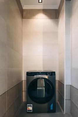 a bathroom with a washing machine in a room at Luxor Nile View Apartment Marah 1 in Luxor