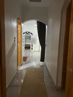 a hallway with an archway in a house at The Palace Guesthouse in Luxor